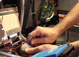 Technician working on game wires